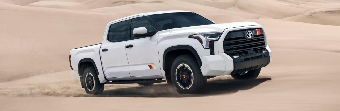 front quarter view of the 2026 Toyota Tundra navigating the sand