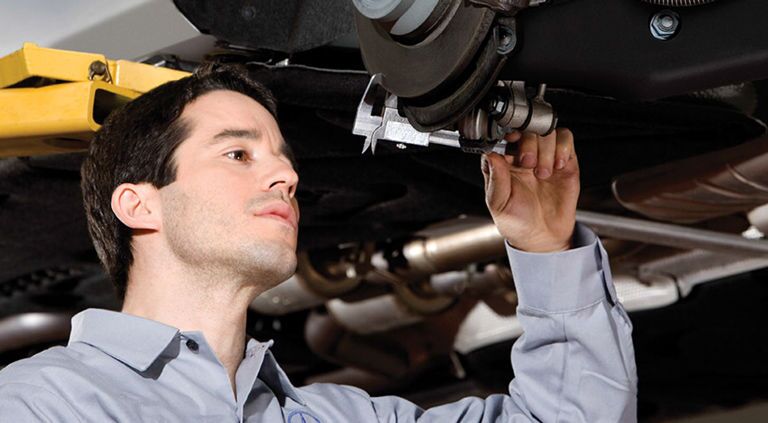 service mechanic checking car