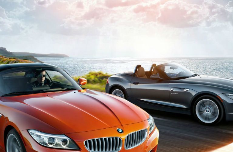 orange and gray bmw z4 by water