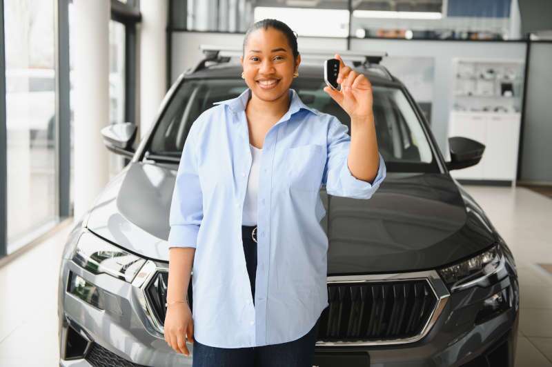 A woman after financing a used vehicle