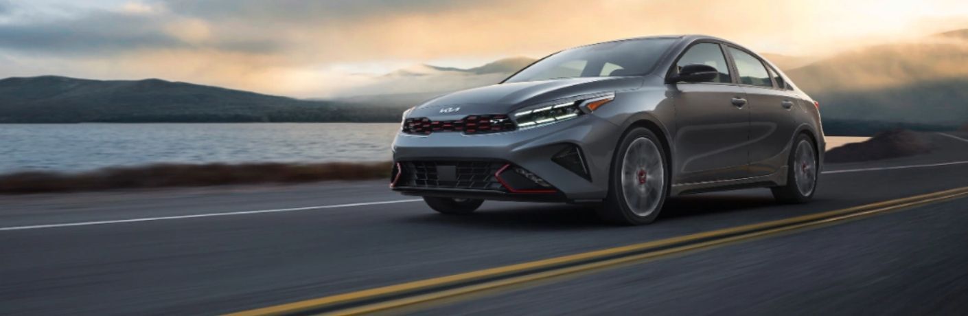 Kia sedan on a city road