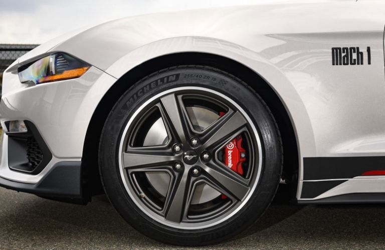 Close up of a wheel of a Ford Mustang is shown.