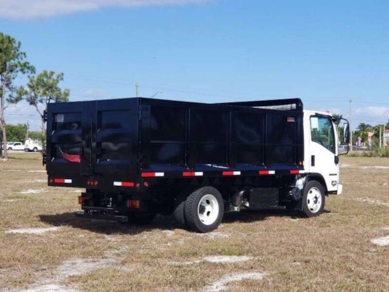 A side exterior view of a landscaping dump truck for sale in South Florida