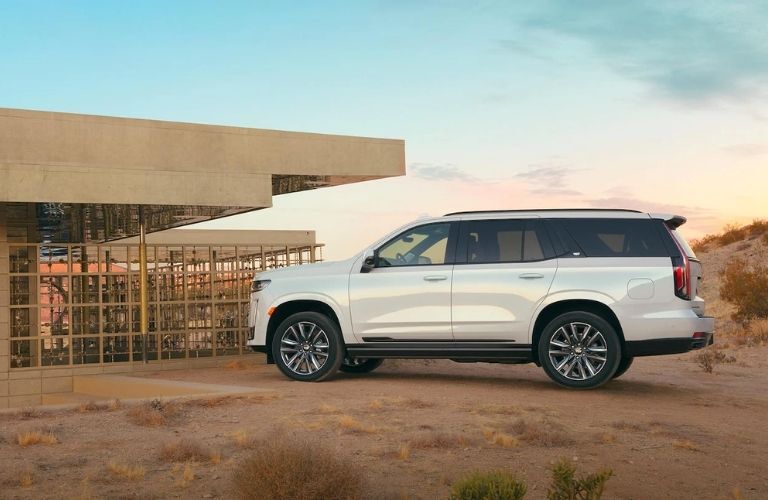 Cadillac SUV outside a house