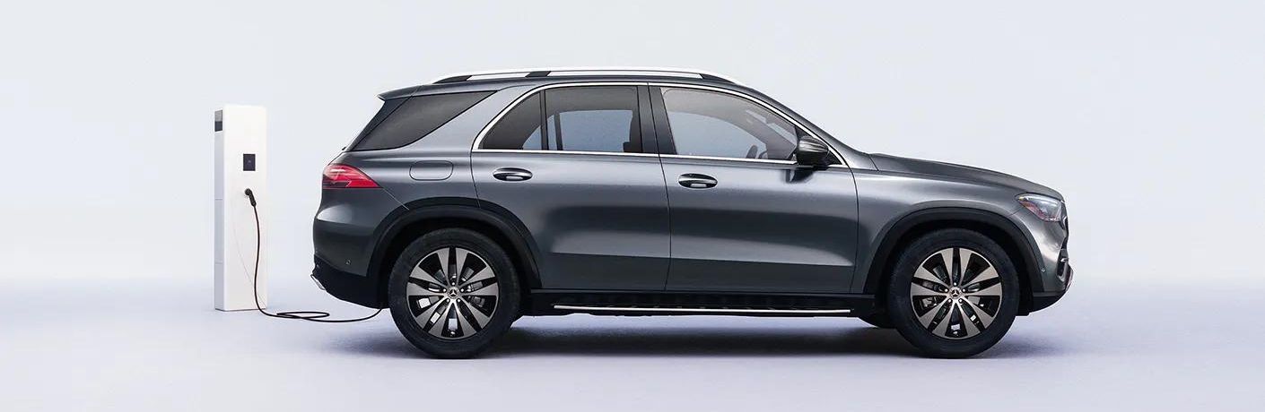 Side view of the 2024 Mercedes-Benz GLE 450 4MATIC SUV Gray charging