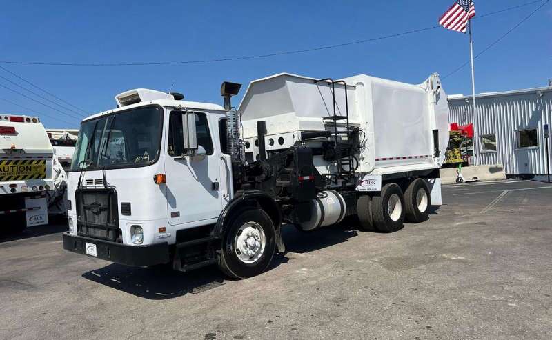 A used Autocar garbage truck from Dirt Cheap Truck Sales in Tampa, FL.