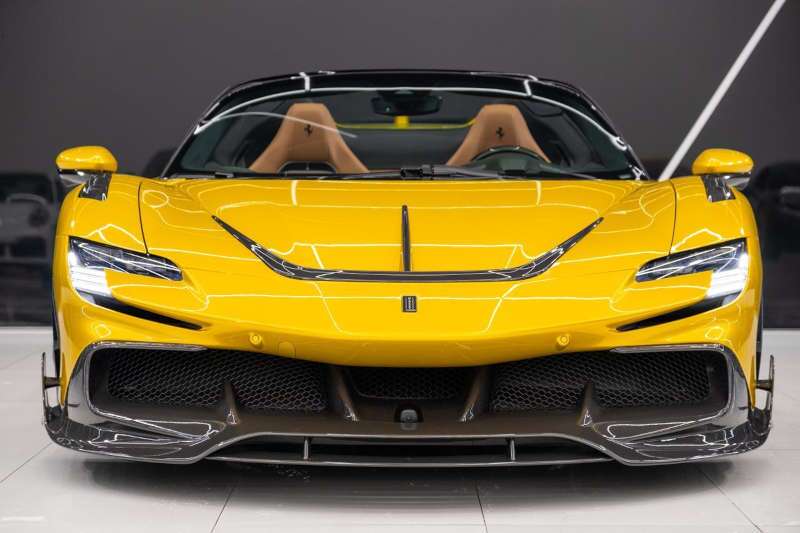 A front exterior view of the 2022 Ferrari SF90 Spider Mansory Edition