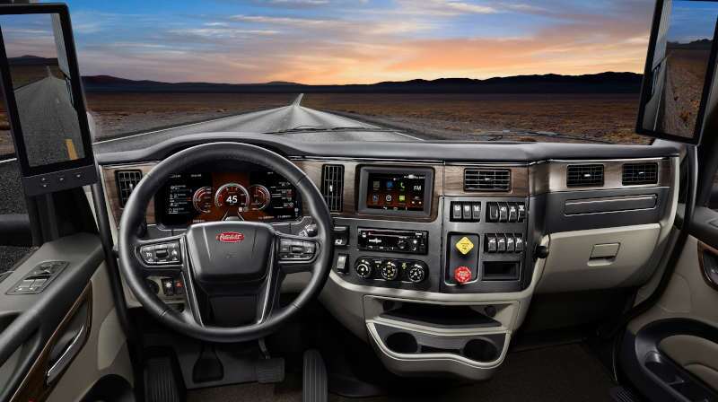 The high-tech, comfortable cab of a Peterbilt dump truck