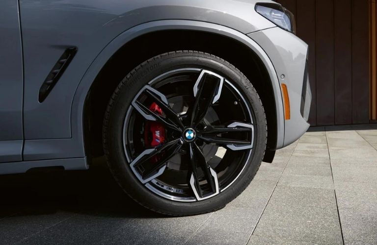 Close up image of a wheel of BMW is shown