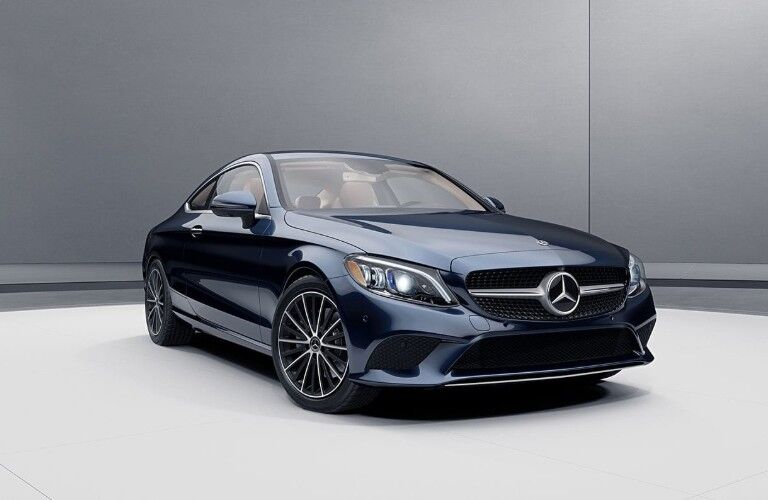 Front passenger angle of a blue 2020 Mercedes-Benz C-Class Coupe