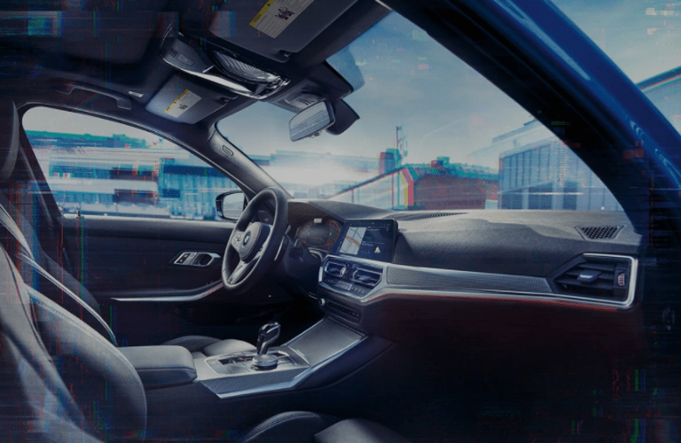 Side view of the 2022 BMW 3-Series steering wheel and interior