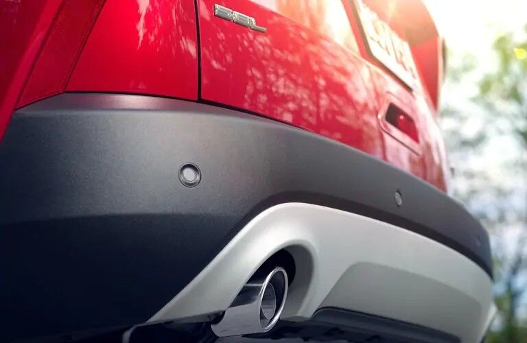 Rear exhaust pipe of red 2020 Ford Escape SEL