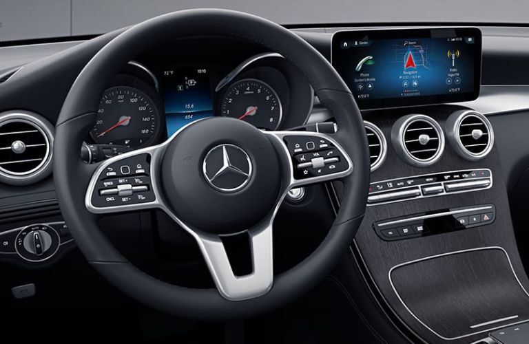 Image showing the steering wheel and 10.25-inch multimedia touchscreen display inside the 2022 Mercedes-Benz GLC 300.