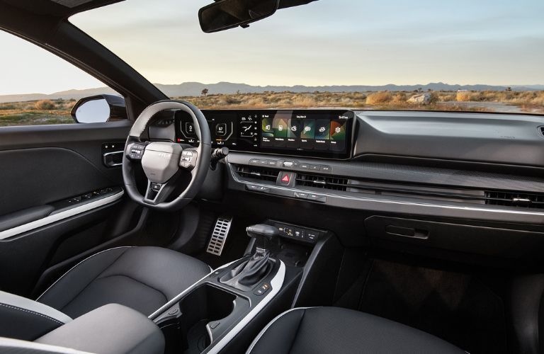 interior steering and dashboard of the 2025 Kia K4