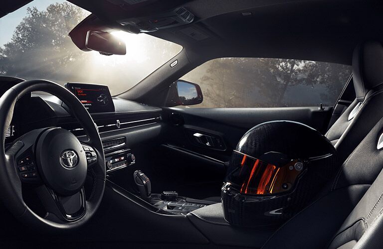 A close-up of the steering wheel and dashboard in the 2022 Toyota GR Supra