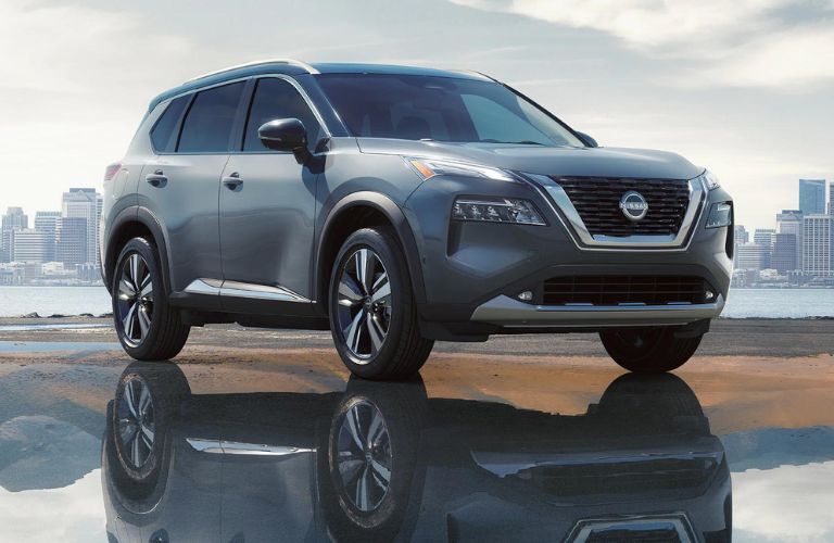 One grey color 2022 Nissan Rogue is parked near a beach