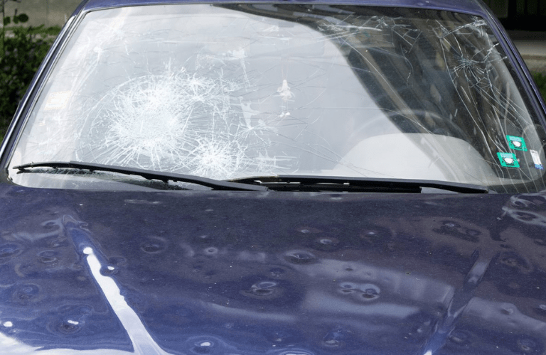 Vehicle with damaged windshield