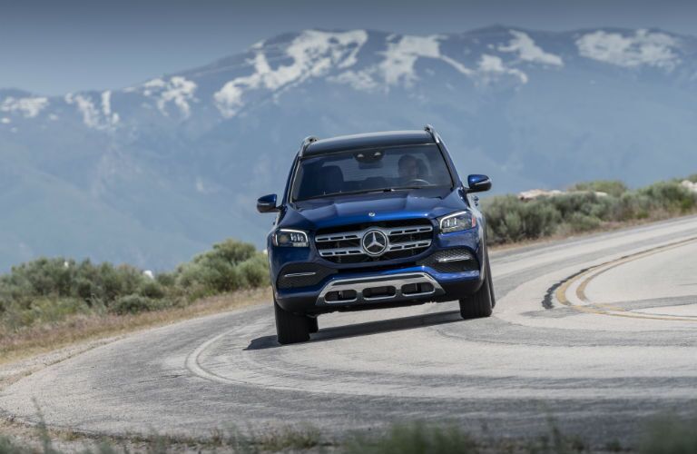 2020 MB GLS exterior front fascia on winding road in front of mountains