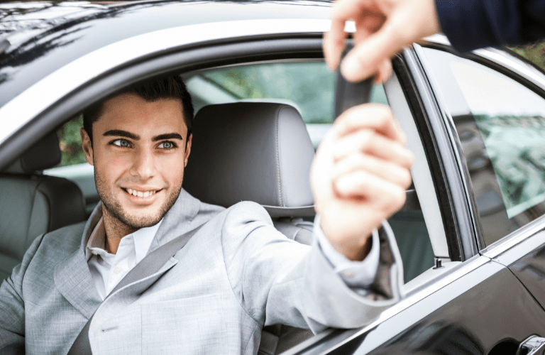 A man taking a key of his vehicle