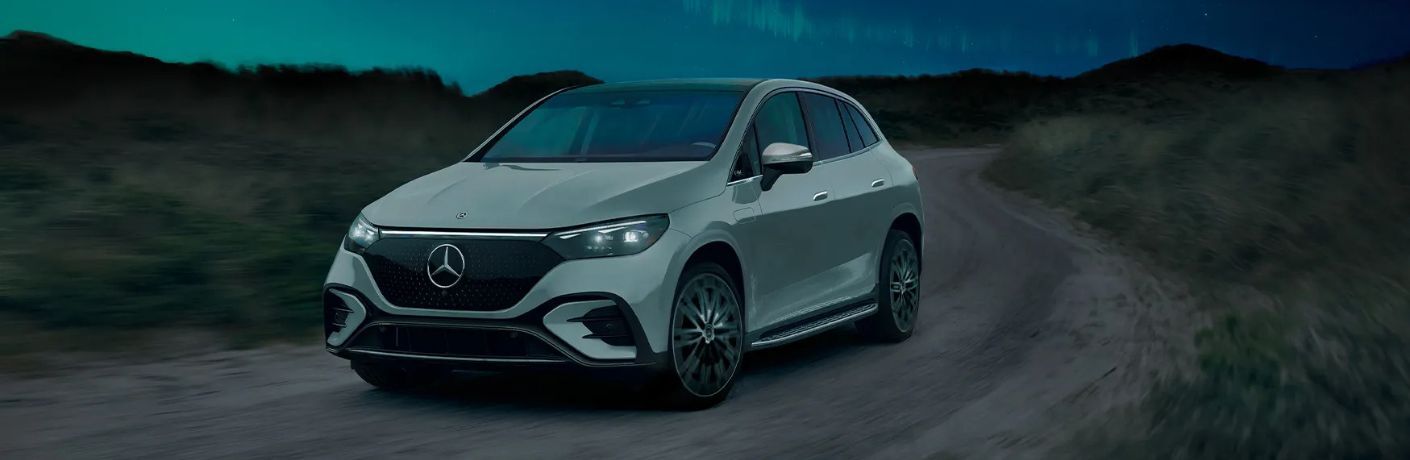 2026 Mercedes-Benz EQE SUV on a dirt trail at night