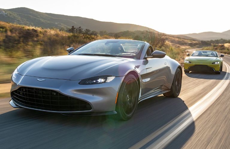 Two Aston Martin Vantgae driving