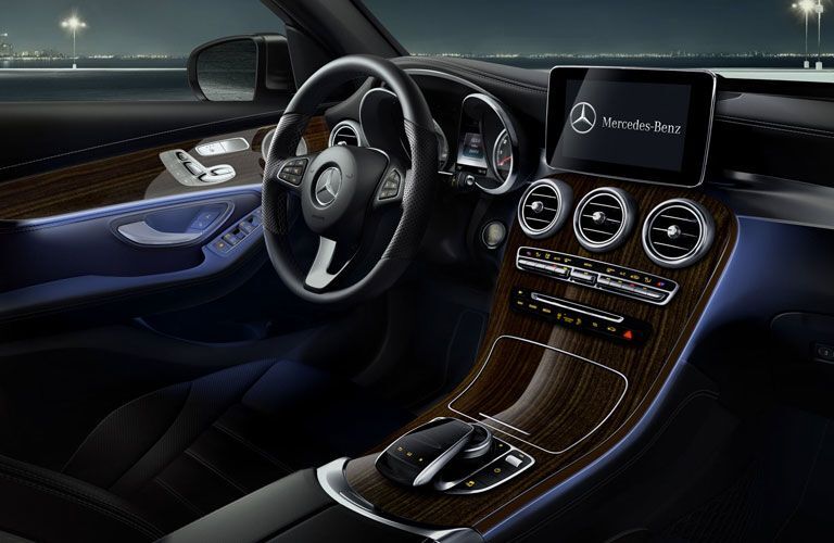 An interior photo of the driver's cockpit in the 2018 Mercedes-Benz GLC SUV.