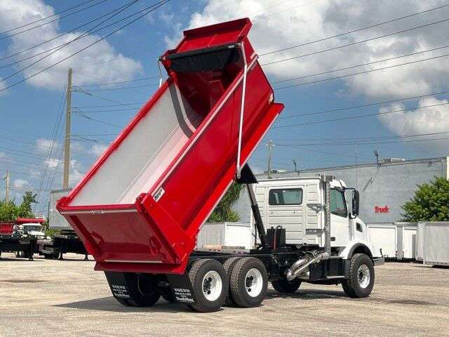 A rear quarter exterior view of a Volvo dump truck