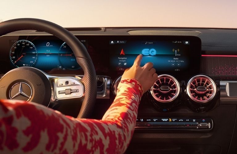 A woman using the 2022 Mercedes-Benz EQB navigation system