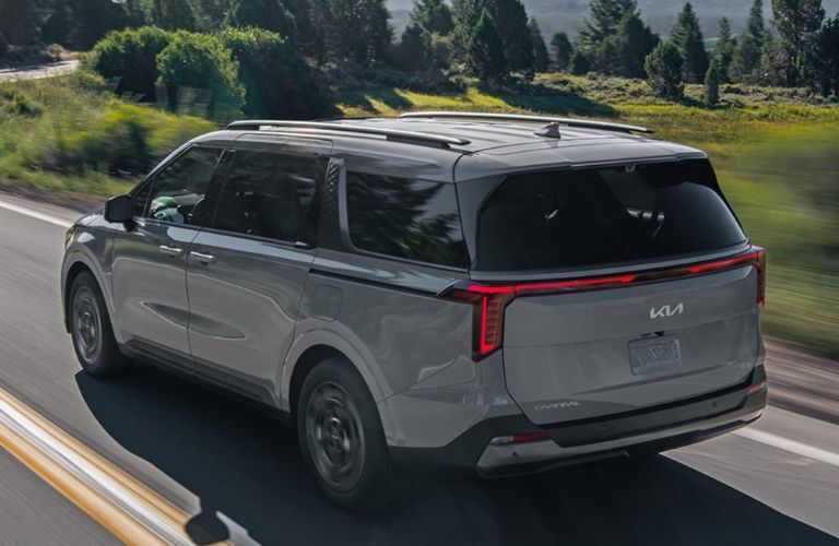 2025 Kia Carnival MPV side and back view