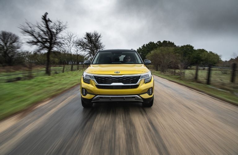 2021 Kia Seltos driving on highway head-on view