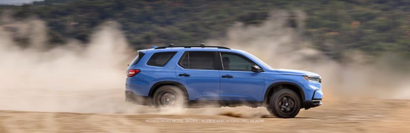 Side view of the 2025 Honda Pilot TrailSport Blue
