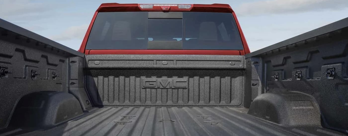 Bed of a red 2022 GMC Sierra 2500 HD used truck for sale near Newark