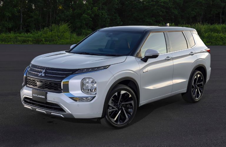 Front quarter view of a white 2023 Mitsubishi Outlander PHEV.