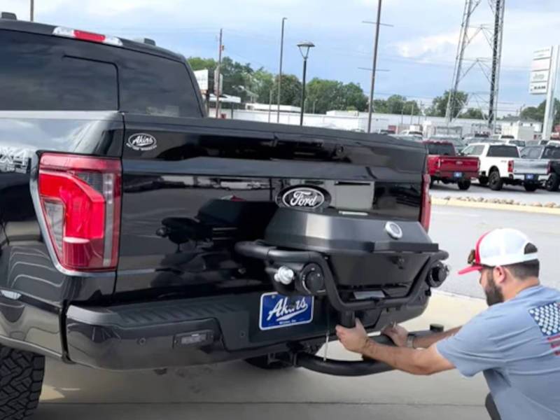 A rear view of a Wild Willies customized truck with a BBQ attachment for the bumper.