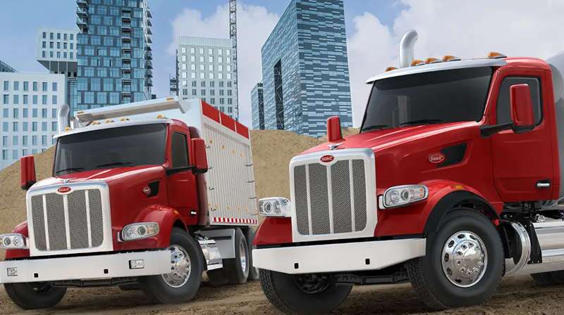 A front quarter exterior view of Peterbilt heavy duty commercial trucks