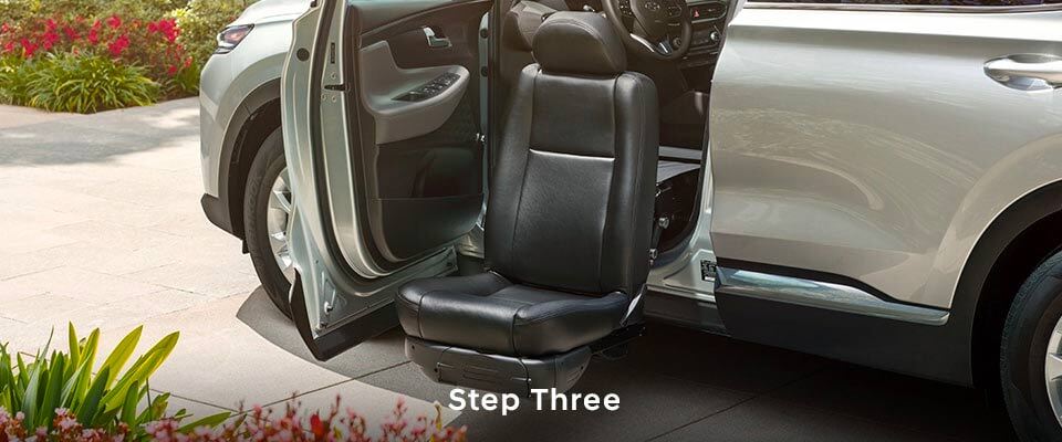 Close up of vehicle with mobility front seat and door open