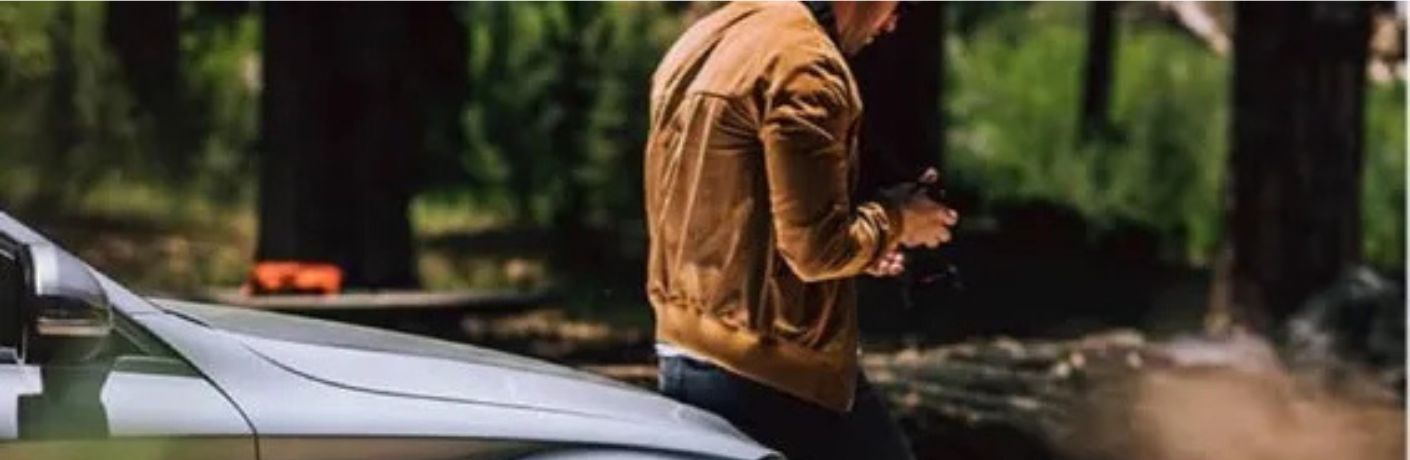 Mercedes-Benz Certified Pre-Owned vehicle with a person on the front end