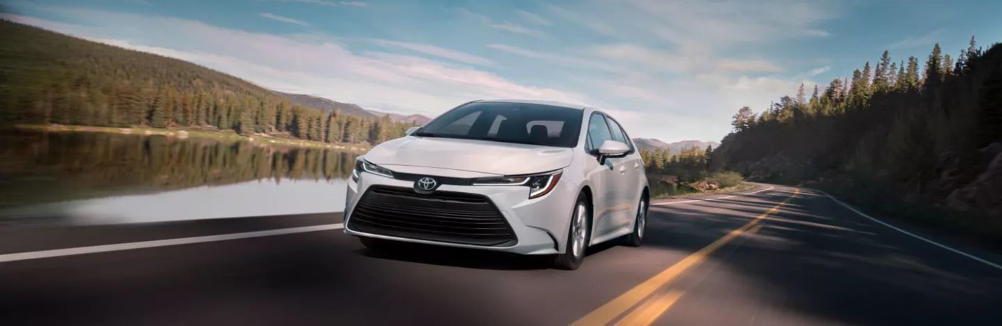 A 2023 Toyota Corolla speeding on a road