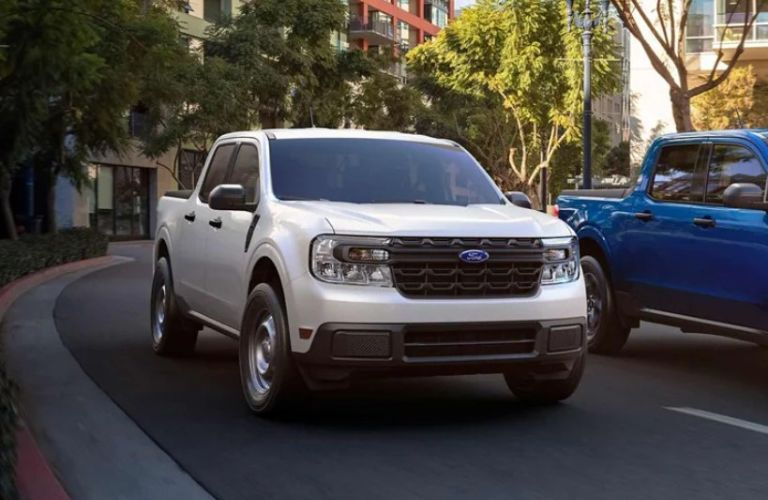 white 2024 Ford Maverick XL on a city street