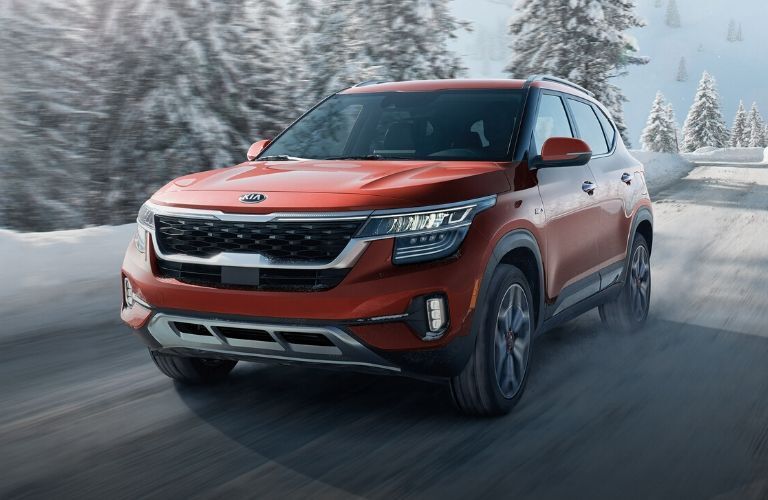 2021 Kia Seltos driving on snowy road