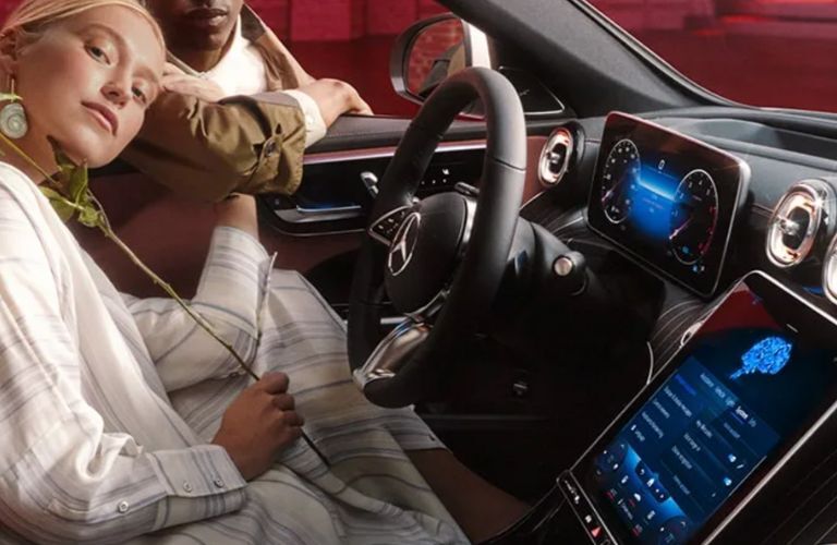 a woman in the 2025 Mercedes-Benz C-Class driving seat
