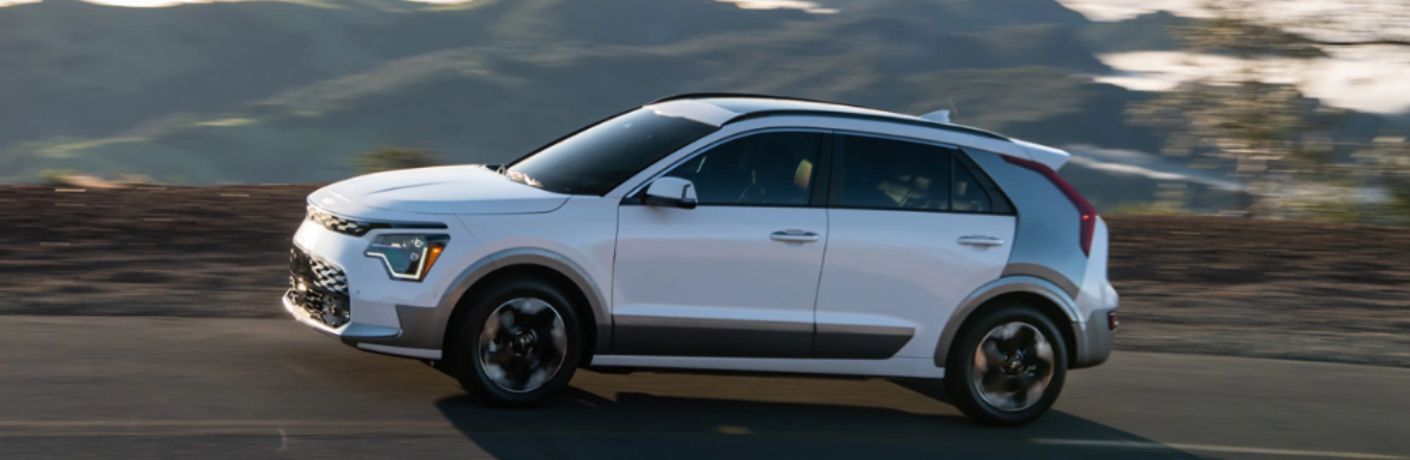 An image of the side view of a white colored 2023 Kia Niro EV