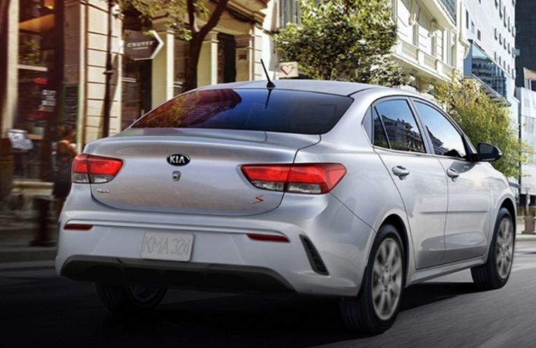 2021 Kia Rio driving rear view