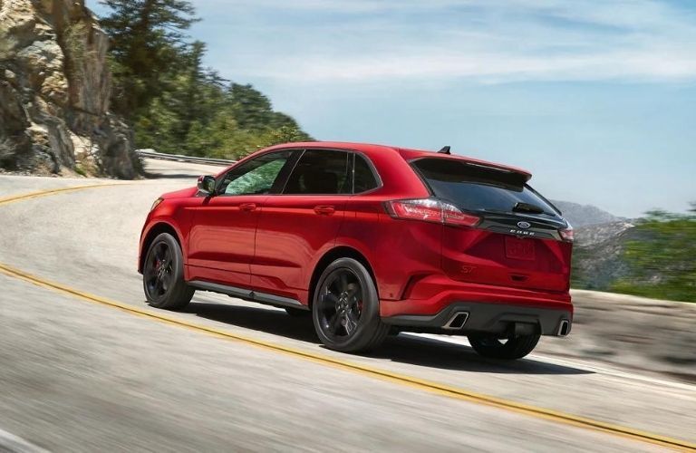 A red 2022 Ford Edge going up the hill.