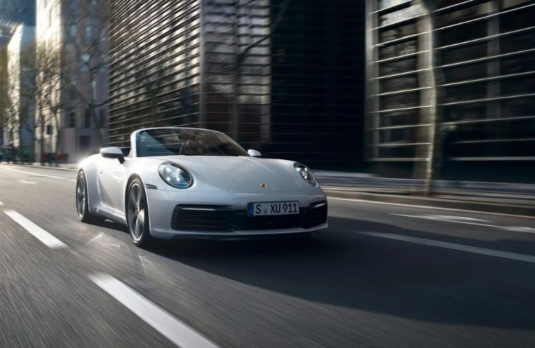 Porsche 911 Convertible Carrera 4 in a city road