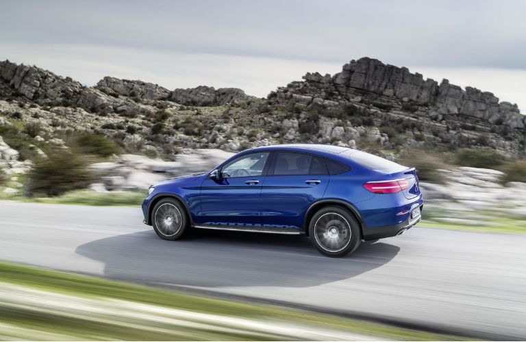 2017 Mercedes-Benz AMG GLC 43 driving by rocks