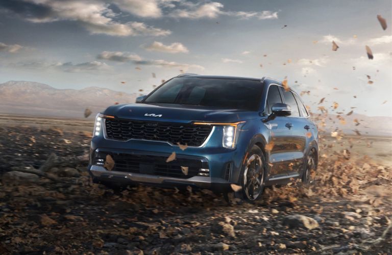 front quarter view of the 2025 Kia Sorento Hybrid in fall terrain