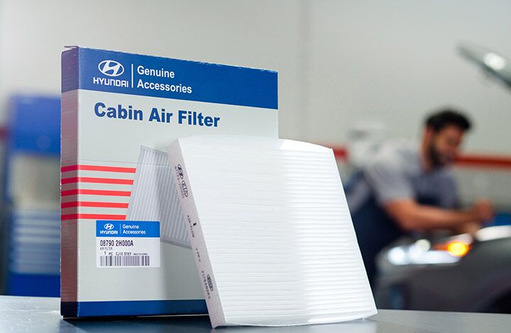 close up of oil being poured into engine