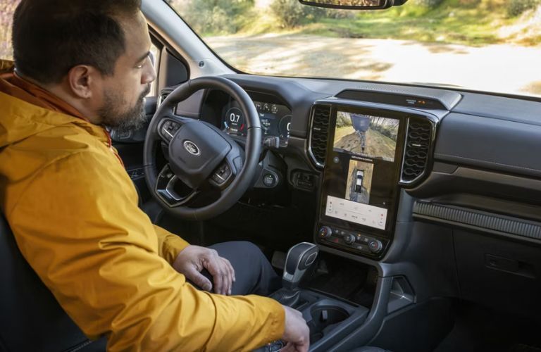 2026 Ford Ranger with a driver using the touchscreen
