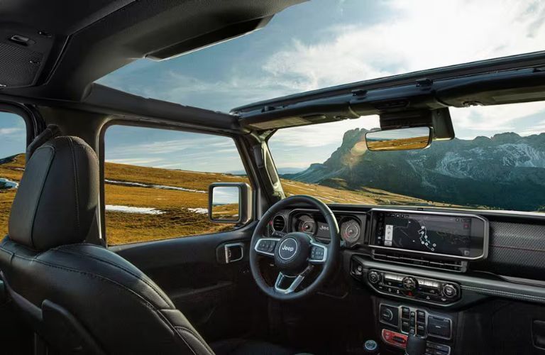 interior steering and dashboard of the 2025 Jeep Wrangler